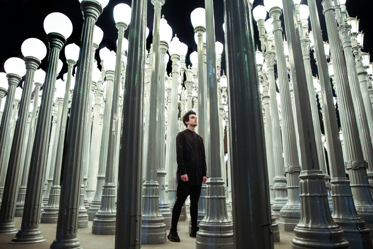 man standing among lights 24-70mm lens photography